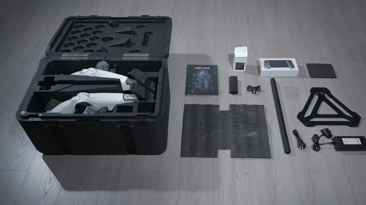 Unitree R1 in its transport case with battery, charger, remote and stand